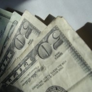 money photo of several fifty dollar bills