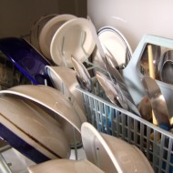 Dishes in Dishwasher photo of clean dishes in the dishwasher - plates, bowls, silverware