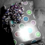 Colorized Birthday Present black and white colorized photo of a wrapped birthday present with curly ribbon