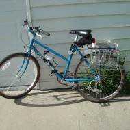 Blue Bicycle photo of blue bicycle with rear bike baskets