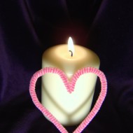 Candle with Pink Heart photo of burning lit candle with flame and pink heart