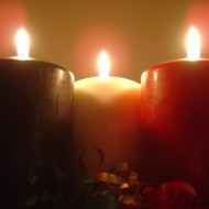 Christmas Candles photo of three green white and red burning holiday christmas candles