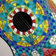 photo of guitar painted to look like colored Mexican tiles
