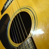 closeup of body of acoustic guitar