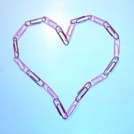Photo of a heart made from a chain of pink and red paperclips