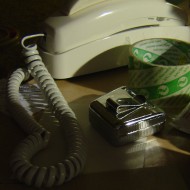 Tape Measure on Cluttered Desk Photo showing tape measure, phone and tape on Cluttered desk