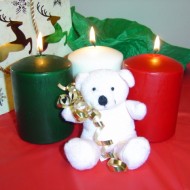 Teddy Bear with Christmas Candles Photo of white teddy bear with burning Christmas candles
