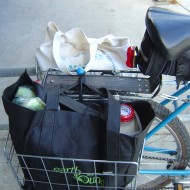 Groceries in Bike Basket photo of rear bicycle baskets full of bags of groceries