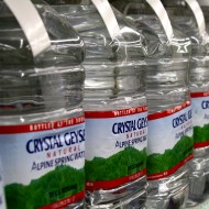 Free high resolution photo of a store shelf full of bottled water