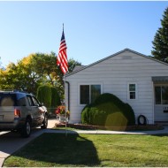 free high resolution photo of a house with an American flag and SUV