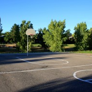 Free photo of an outdoor basketball court with blacktop pavement Free photo of an outdoor basketball court with blacktop pavement