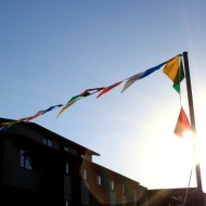 free photo of pennant flags with sun in background