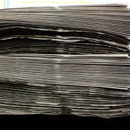 free high resolution photo of a stack of newspapers