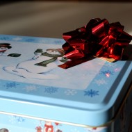 Red Bow atop Holiday Cookie Tin - free high resolution photo Red Bow atop Holiday Cookie Tin - free high resolution photo