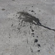 black-paint-splatter-on-cement-sidewalk-thumbnail