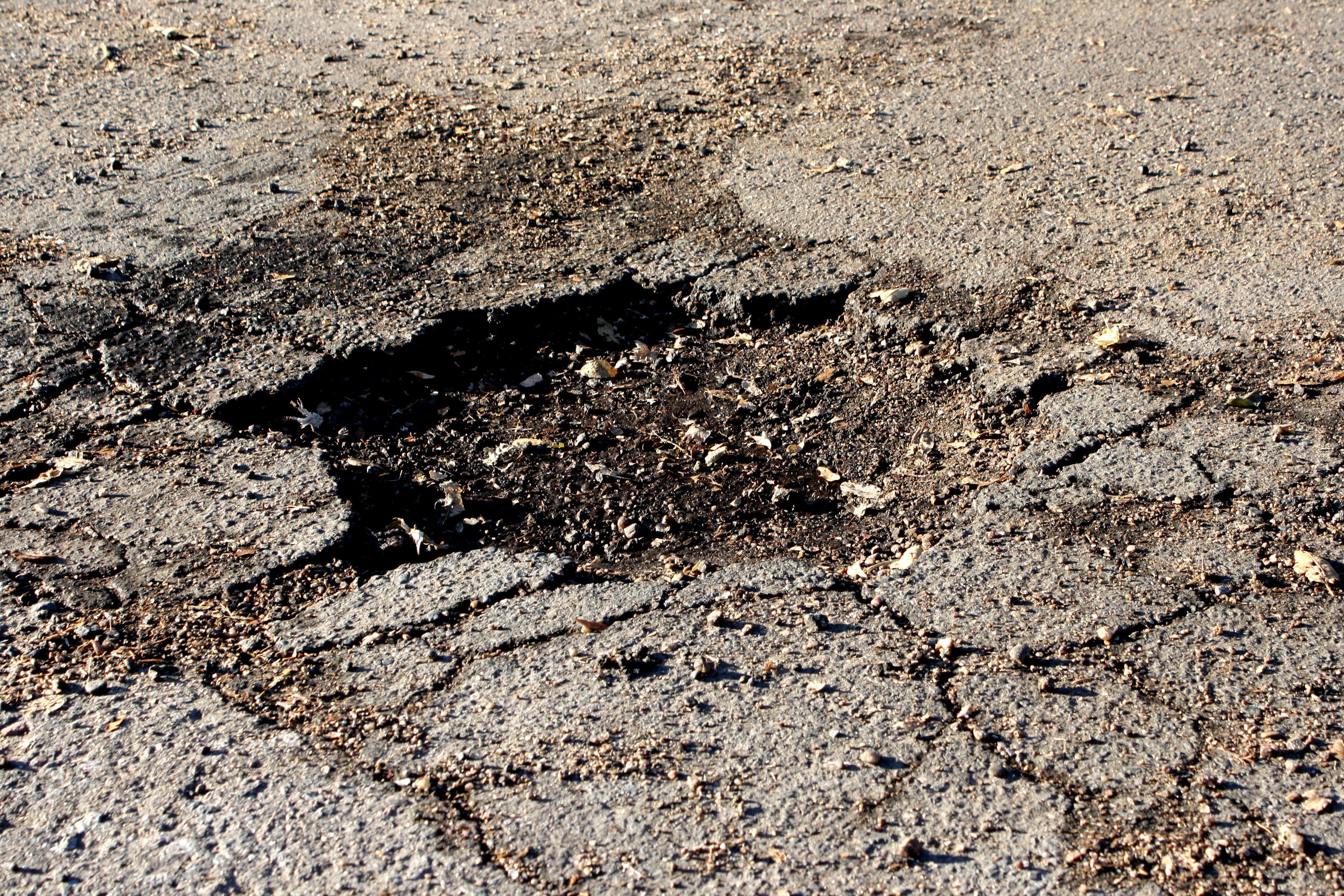Pothole in the Road Picture | Free Photograph | Photos ...