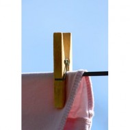 wooden-clothespin-holding-drying-laundry-on-clothesline-thumbnail