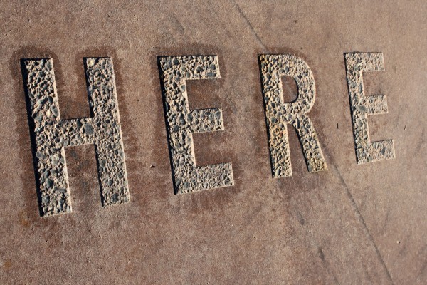 Here - The Word "Here" Set in Concrete - Free High Resolution Photo