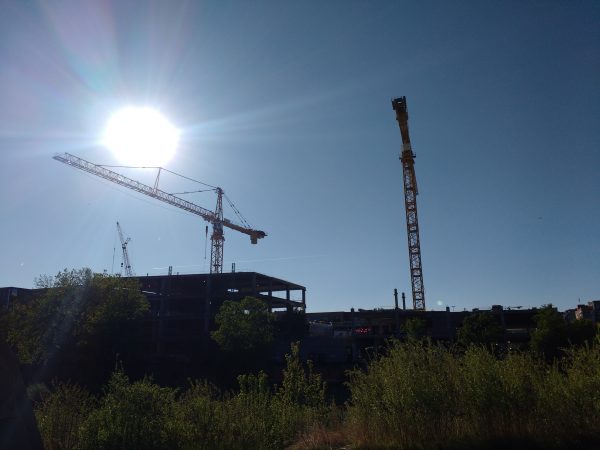 Blue Sky with Construction Cranes and Sun - Free High Resolution Photo