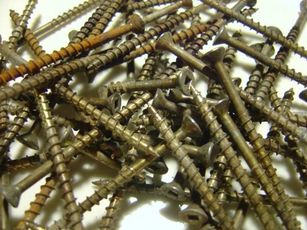 close up photo of used brass deck screws