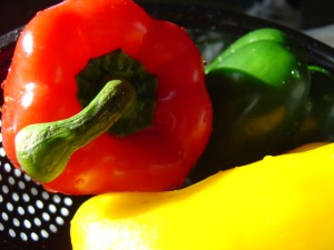 photo of red green and yellow bell peppers