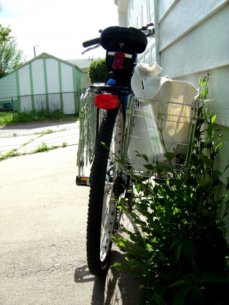 photo of bicycle from rear with baskets