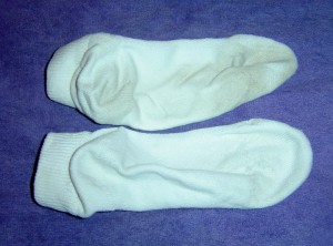 photo of one clean sock and one dirty sock comparison