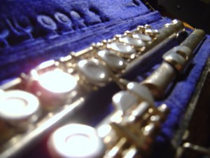 photo of silver flute in blue velvet flute case