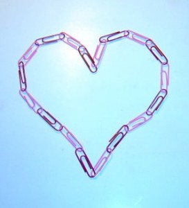 Photo of a heart made from a chain of pink and red paperclips