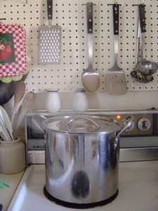 photo of a silver colored stock pot on the kitchen stovetop