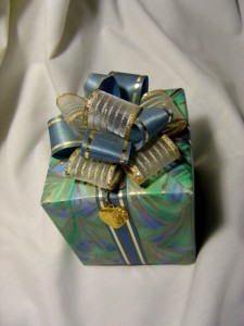 photo of wrapped package with a bow and a heart
