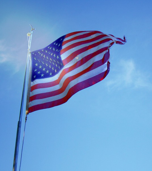 Free photo of an American flag flying in the wind