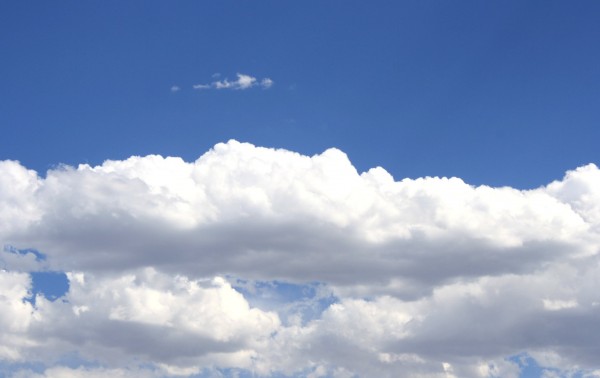 free photo of white cotton clouds in a bright blue sky