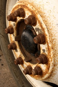 Free closeup photo of a rusty truck wheel