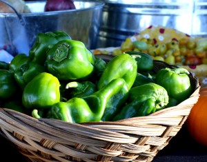 Free photo of a basket full of green peppers