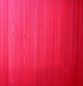 Free photo of a wall of wood paneling painted red