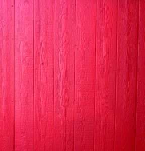 Free photo of a wall of wood paneling painted red