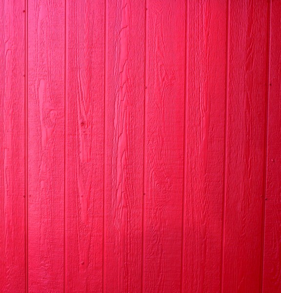 Free photo of a wall of wood paneling painted red