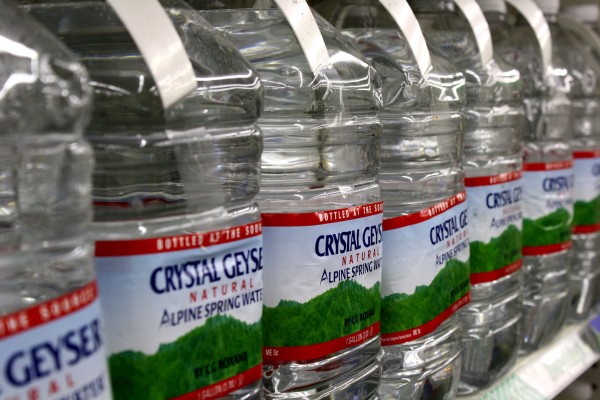 Free high resolution photo of a store shelf full of bottled water