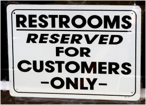 Free high resolution photo of a sign reading restrooms reserved for customers only
