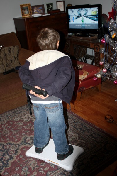 Child Playing with Wii Fit - free high resolution photo