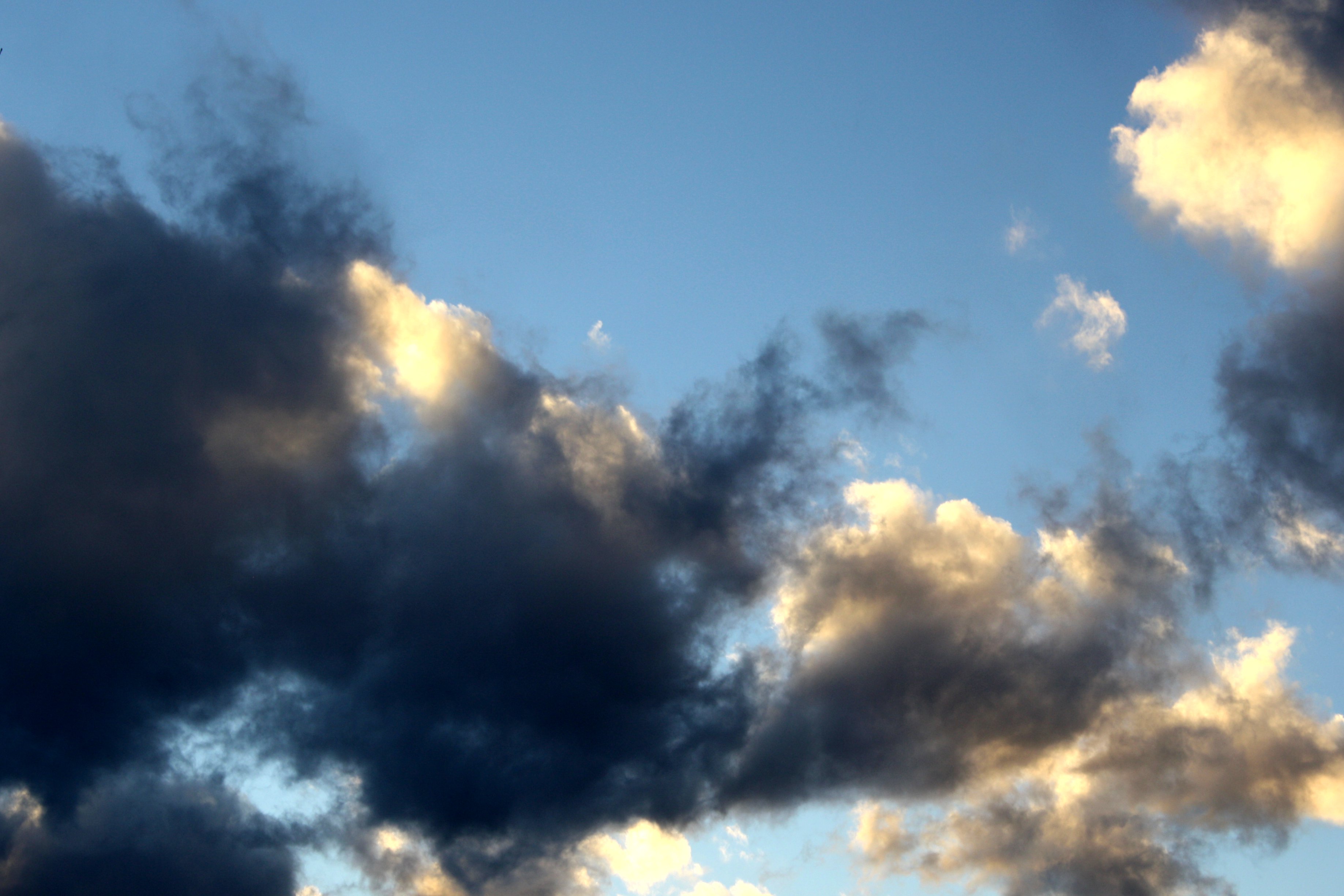 Blue Sky With Golden And Black Clouds Picture Free Photograph