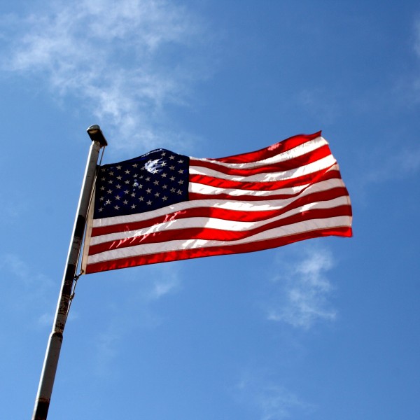 American Flag against Blue Sky - Free High Resolution Photo