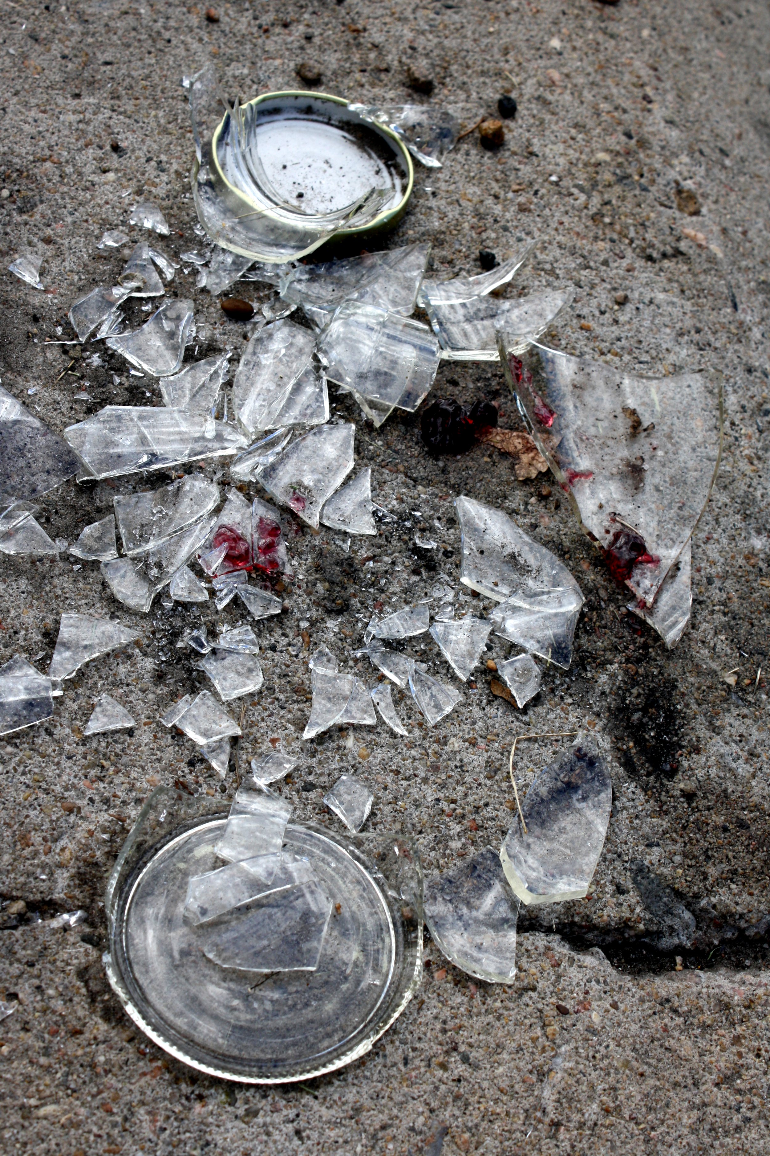 Broken Glass Jar On Sidewalk Picture Free Photograph