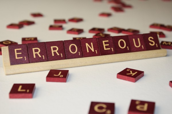 Erroneous - Free High Resolution Photo of the word erroneous spelled in Scrabble tiles
