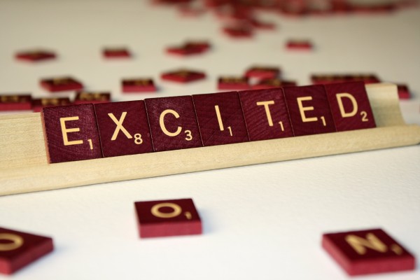 Excited - Free High Resolution Photo of the word Excited spelled in Scrabble tiles
