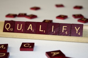 Qualify - Free High Resolution Photo of the word Qualify spelled in Scrabble tiles