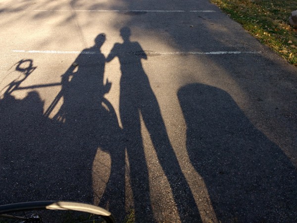 Elongated Shadows of Two People and a Bike - Free High Resolution Photo