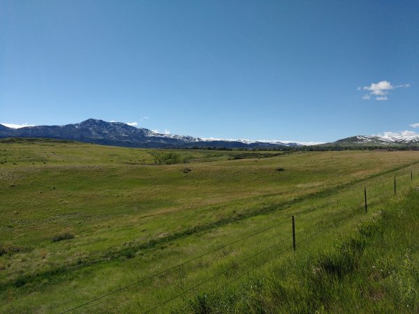 Green Field with Mountains in the Distance - Free High Resolution Photo